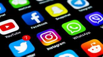 A smartphone screen depicting social media apps YouTube, Facebook, Snapchat, Telegram, Twitter (now X), Instagram, Whatsapp, Skype, Reddit, etc. | Bigtunaonline | Dreamstime.com