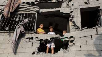 Palestinian boys standing in destroyed building in Gaza | CHINE NOUVELLE/SIPA/Newscom