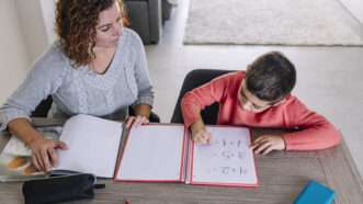 Homeschooling parent and child | DPST/Newscom