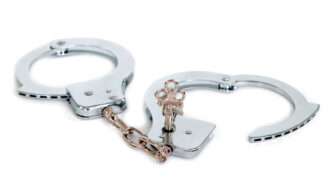 Unlocked handcuffs against a white background. | Teamarbeit | Dreamstime.com