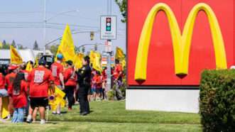 Fast food workers protest outside a McDonald's in California. | Cameron Clark/TNS/Newscom