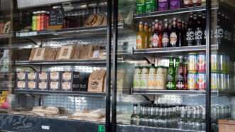 Cooler display with drinks and premade meals. | Mara Robinson | Dreamstime.com