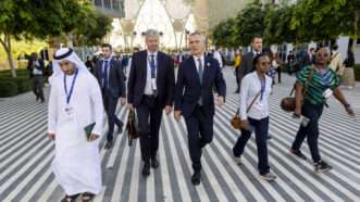 Attendees of the Cop28 climate conference in Dubai walking | NATO / Polaris/Newscom