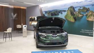 VinFast Lux SA2.0 electric vehicle sits in a Santa Monica showroom with its hood popped. | 	Taidgh Barron/ZUMAPRESS/Newscom