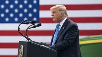 Donald Trump speaking in front of a flag | Shealah Craighead/White House/ZUMA Press/Newscom
