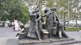 The Immigrants monument by Luis Sanguino, in Battery Park, Lower Manhattan. | Viocara | Dreamstime.com