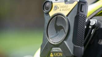 Close-up of AXON body camera affixed to a police officer's uniform. | John Gomez | Dreamstime.com