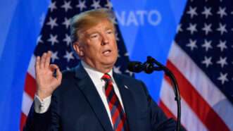 Then-President Donald Trump speaks press conference during the 2018 NATO summit in Brussels, Belgium. | Gints Ivuskans | Dreamstime.com