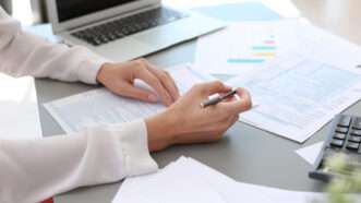 An accountant is seen preparing tax forms | Photo 120706109 | Accountant © Chernetskaya | Dreamstime.com