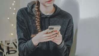 Teen girl on her smartphone | Photo by <a href="https://unsplash.com/@laurachouette?utm_content=creditCopyText&utm_medium=referral&utm_source=unsplash">Laura Chouette</a> on <a href="https://unsplash.com/photos/woman-in-black-sweater-holding-white-smartphone-vhy5QcB3HIA?utm_content=creditCopyText&utm_medium=referral&utm_source=unsplash">Unsplash</a>   
