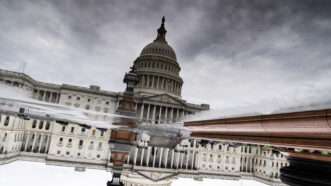 U.S. Capitol Building reflecting on water | Tom Williams/CQ Roll Call/Newscom