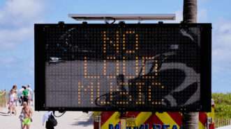 A digital sign in Miami Beach reading NO LOUD MUSIC | MEGA/Newscom/FRIDA/Newscom