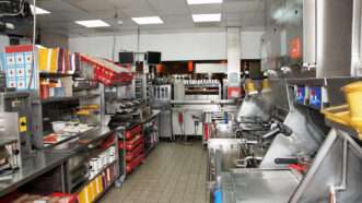 Commercial kitchen in a fast food restaurant, clean and empty as if untouched. | Fedor Kondratenko | Dreamstime.com