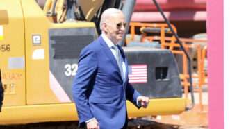 President Joe Biden walks to the podium at the construction site of an Intel plant in Chandler, Arizona. | Alexandra Buxbaum/Sipa USA/Newscom