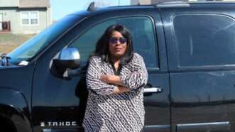 Dewonna Goodridge standing near her truck | Kansas Justice Institute
