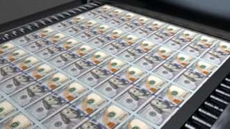 Dollar bills on a printing press | Photo 243426681 © Incredivfx | Dreamstime.com