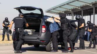 Customs and border protection officers and Drug enforcement administration special forces participate in a training. Unrecognizable people in black | Photo 150686161 | Airport © Belish | Dreamstime.com
