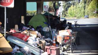 Homeless encampment under a overpass up in Oakland, California. | Blackkango | Dreamstime.com