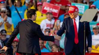 Marco Rubio shakes hands with Donald Trump on a stage at a rally | Matias J. Ocner/TNS/Newscom