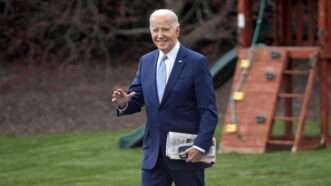 Joe Biden walks past a playground and waves | Sipa USA/Newscom