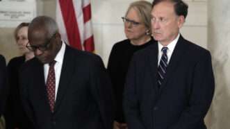 Supreme Court Justice Samuel Alito stands next to Clarence Thomas and others with the American flag in the background | Jacquelyn Martin - Pool via CNP / MEGA / Newscom/RSSIL/Newscom