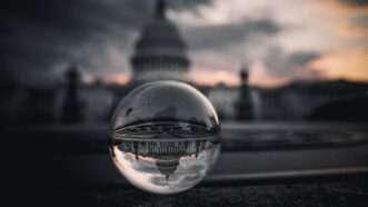 An artistic photo of the U.S. Capitol seen through a clear sphere | Photo by Dineda Nyepan on Unsplash