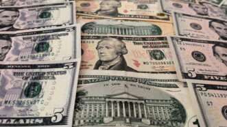 Various U.S. paper money notes in close up | Maksim Konstantinov/ZUMAPRESS/Newscom