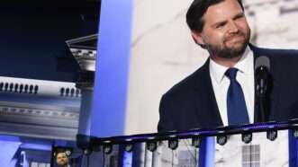 JD Vance on convention stage and also on big screen above convention stage | Phil McAuliffe/Polaris/Newscom