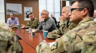 Minnesota Gov. Tim Walz meets with National Guard officers and local authorities on about damage caused by a winter storm in Austin, Minnesota. April 13, 2019. | Minnesota National Guard photo by Sgt. Sebastian Nemec