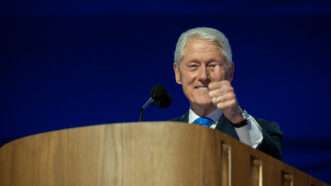 Former President Bill Clinton gives a thumbs up while speaking at the 2024 Democratic National Convention. | Annabelle Gordon - CNP/Newscom