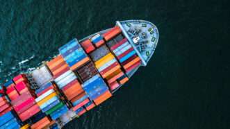 A cargo ship transports goods | ID 114206008 © Mr.siwabud Veerapaisarn | Dreamstime.com