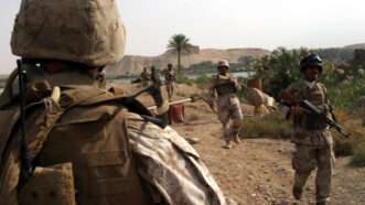 Iraqi soldiers and U.S. Marines conduct a foot patrol in Haditha, Iraq, Oct. 31, 2006. | Luke Blom/ZUMA Press/Newscom