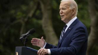 Joe Biden speaking behind podium outside | Samuel Corum - Pool via CNP/picture alliance / Consolidated News Photos/Newscom