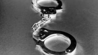 Handcuffs | 	TEK IMAGE/SCIENCE PHOTO LIBRARY/Newscom