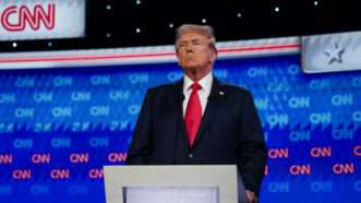 Donald Trump standing at a podium during June's presidential debate | ELIJAH NOUVELAGE/UPI/Newscom