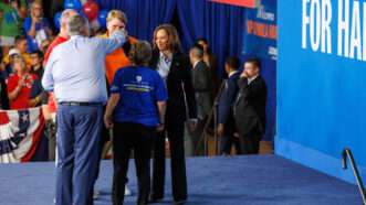 Kamala Harris on stage with greeting supporters | Andrew Roth/ZUMAPRESS/Newscom