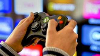 Someone using a video game controller |  © Razvan Nitoi | Dreamstime.com