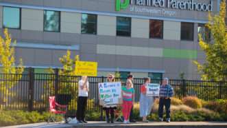 Protesters lined up outside a Planned Parenthood facility | Joshua Rainey | Dreamstime.com