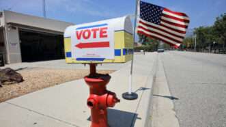 A mailbox with a VOTE sign and arrow. | Joe Sohm | Dreamstime.com