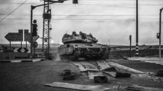 A tank with Israeli soldiers on the country's border with Gaza. | Ilia Yefimovich/dpa/picture-alliance/Newscom