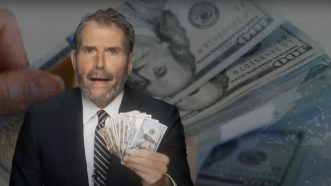 John Stossel is seen with a wad of cash | Stossel TV