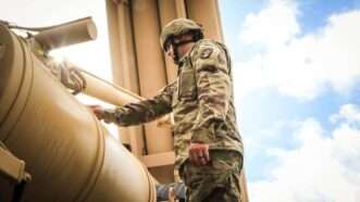 A U.S. Soldier with Task Force Talon, finished checking the fuel levels of an Army heavy expanded mobility tactical truck (HEMETT) used as part of a Terminal High Altitude Area Defense weapon system on Andersen Air Force Base, Guam, Oct. 26, 2017. | Polaris/Newscom