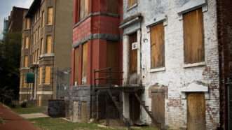 Boarded up rowhouses | Camrocker/Dreamstime.com