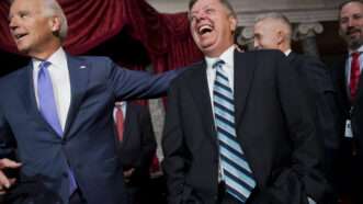 Sen. Lindsey Graham, R-S.C., right, shares a laugh with Vice President Joe Biden after a mock swearing-in ceremony for Sen. Tim Scott, R-S.C., in the Capitol's Old Senate Chamber, December 2, 2014. | Tom Williams/CQ Roll Call/Newscom