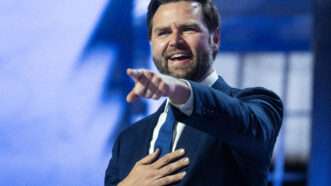 Sen. J.D. Vance points to crowd at the Fiserv Forum. | Tom Williams/CQ Roll Call/Newscom