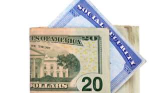 A Social Security card sandwiched in a $20 bill | ID 34676655 © Kim Reinick | Dreamstime.com