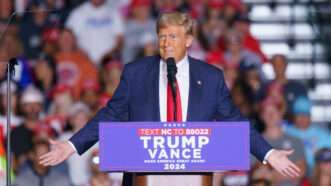 Donald Trump speaks at a podium at a campaign rally |  Josh Brown/ZUMAPRESS/Newscom