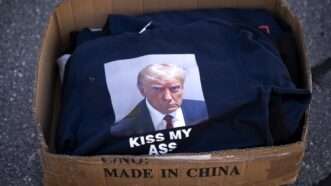 "Kiss My Ass" T-shirts featuring a scowling Donald Trump | ANP/Zuma Press/Newscom