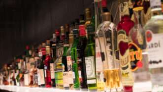 Bottles of liquor on a bar shelf | Dreamstime