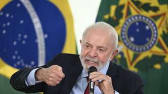 Brazilian president Luiz Inacio Lula da Silva at a podium | Mateus Bonomi/AGIF/Sipa USA/Newscom